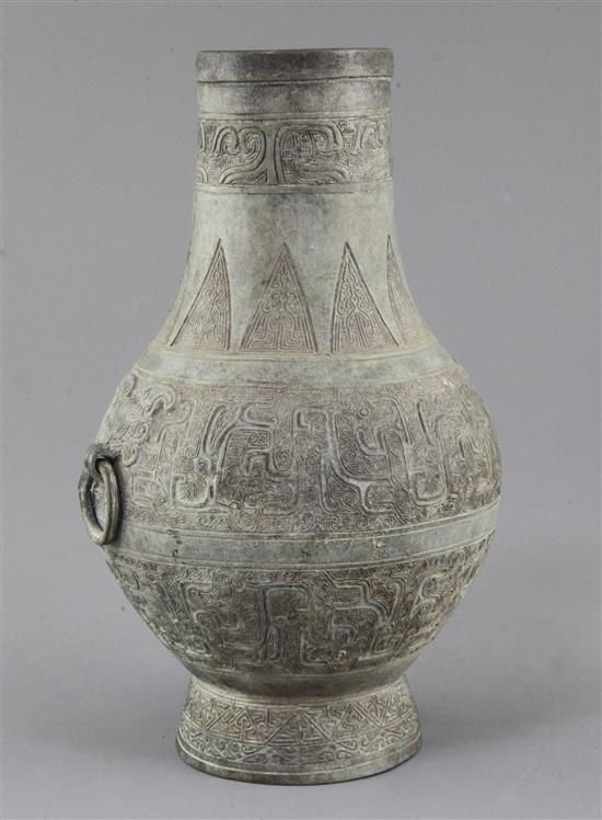 A Chinese archaic bronze ritual wine vessel, Hu, Eastern Zhou dynasty, 5th-3rd century B.C., 24cm high, small hole